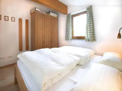 Ein Bett oder Betten in einem Zimmer der Unterkunft Holiday flats Bärlerhof, Königsleiten
