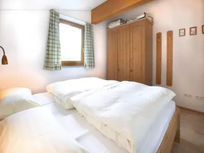 Ein Bett oder Betten in einem Zimmer der Unterkunft Holiday flats Bärlerhof, Königsleiten