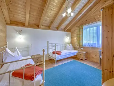 Ein Bett oder Betten in einem Zimmer der Unterkunft Feriendorf Wildschönau-Near ski area