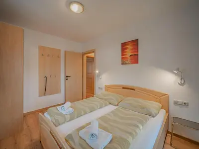 Ein Bett oder Betten in einem Zimmer der Unterkunft Apartment in Brixen im Thale with parking