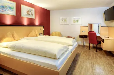 Ein Bett oder Betten in einem Zimmer der Unterkunft Hotel & Art Kristiana
