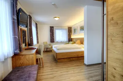 Ein Bett oder Betten in einem Zimmer der Unterkunft Hotel & Art Kristiana