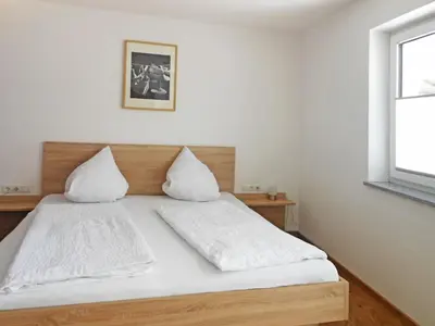 Ein Bett oder Betten in einem Zimmer der Unterkunft Apartment Hanser by Interhome