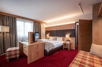 Ein Bett oder Betten in einem Zimmer der Unterkunft Hotel Andreas Hofer
