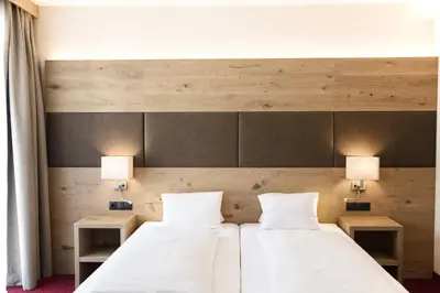 Ein Bett oder Betten in einem Zimmer der Unterkunft Hotel Andreas Hofer