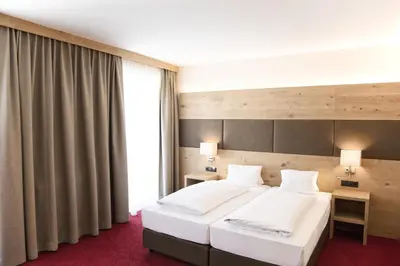 Ein Bett oder Betten in einem Zimmer der Unterkunft Hotel Andreas Hofer