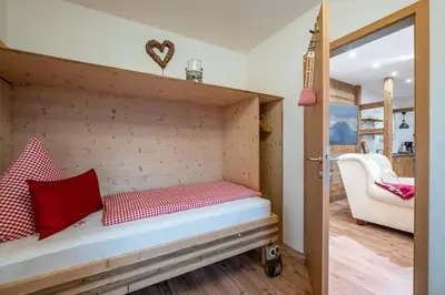Ein Bett oder Betten in einem Zimmer der Unterkunft Ferienwohnung Bergwelt