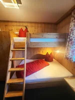 Ein Bett oder Betten in einem Zimmer der Unterkunft Traum-Ferienwohnungen Wechselberger Schwendau