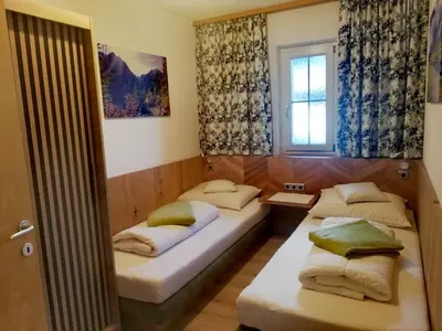 Ein Bett oder Betten in einem Zimmer der Unterkunft Traum-Ferienwohnungen Wechselberger Schwendau