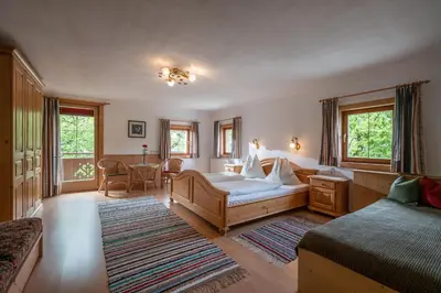 Ein Bett oder Betten in einem Zimmer der Unterkunft Tuxerhof