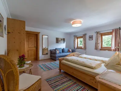 Ein Bett oder Betten in einem Zimmer der Unterkunft Tuxerhof
