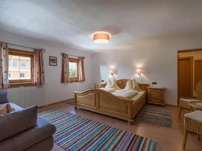 Ein Bett oder Betten in einem Zimmer der Unterkunft Tuxerhof