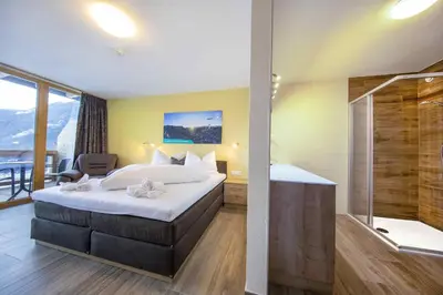 Ein Bett oder Betten in einem Zimmer der Unterkunft Hotel Krimml