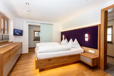 Ein Bett oder Betten in einem Zimmer der Unterkunft Feriengut Ottacherhof - Active Family Holiday in central Hollersbach
