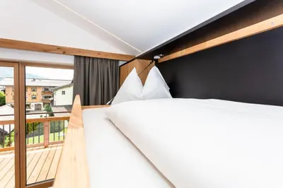 Ein Bett oder Betten in einem Zimmer der Unterkunft Feriengut Ottacherhof - Active Family Holiday in central Hollersbach