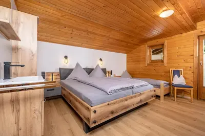 Ein Bett oder Betten in einem Zimmer der Unterkunft Almstüberl - Schiestl's Ferienhütten