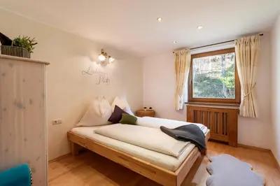 Ein Bett oder Betten in einem Zimmer der Unterkunft Haus Alpenrose