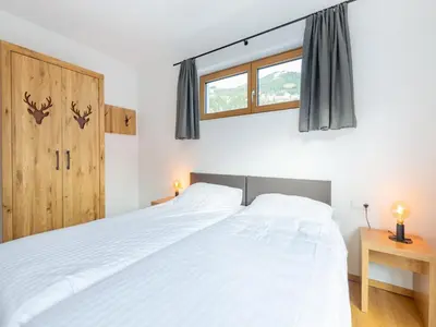 Ein Bett oder Betten in einem Zimmer der Unterkunft Chalet in Neukirchen near Ski Slopes
