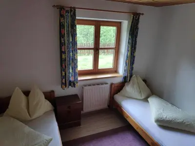 Ein Bett oder Betten in einem Zimmer der Unterkunft Ferienwohnung Waldblick