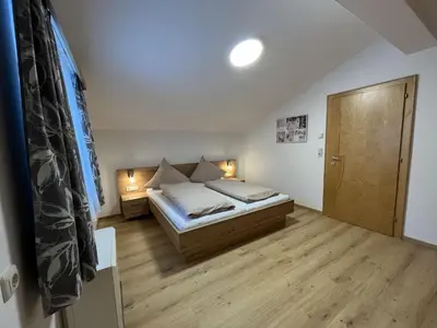 Ein Bett oder Betten in einem Zimmer der Unterkunft Apartment in Wald near Krimml Waterfalls