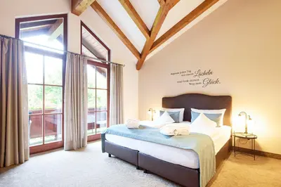 Ein Bett oder Betten in einem Zimmer der Unterkunft Hotel Hubertus