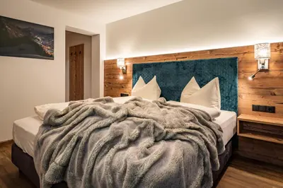 Ein Bett oder Betten in einem Zimmer der Unterkunft Gästehaus Wiesengrund & Apart Sporer