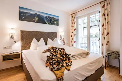 Ein Bett oder Betten in einem Zimmer der Unterkunft Gästehaus Wiesengrund & Apart Sporer