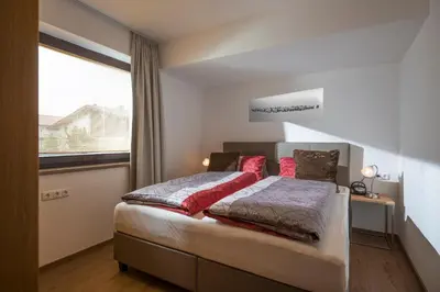 Ein Bett oder Betten in einem Zimmer der Unterkunft Ferienwohnungen Hochfilzer