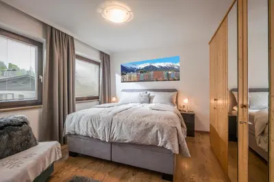 Ein Bett oder Betten in einem Zimmer der Unterkunft Ferienwohnungen Hochfilzer