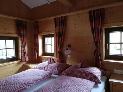 Ein Bett oder Betten in einem Zimmer der Unterkunft Holzfällerhaus Melkstatt
