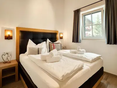 Ein Bett oder Betten in einem Zimmer der Unterkunft Chalet in Krimml near Zillertal Ski Arena