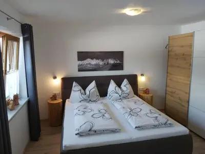 Ein Bett oder Betten in einem Zimmer der Unterkunft Ferienwohnung Innerbichler
