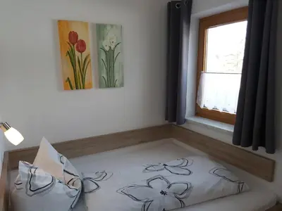 Ein Bett oder Betten in einem Zimmer der Unterkunft Ferienwohnung Innerbichler