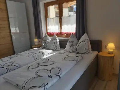 Ein Bett oder Betten in einem Zimmer der Unterkunft Ferienwohnung Innerbichler