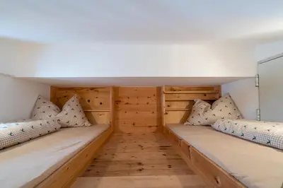 Ein Bett oder Betten in einem Zimmer der Unterkunft Ferienhaus Mittersill am Biohof Widholz