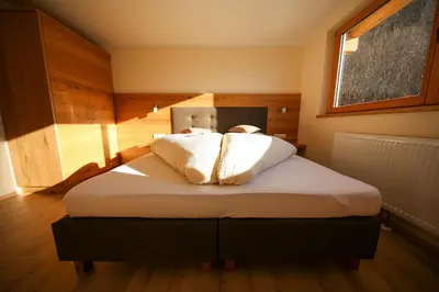Ein Bett oder Betten in einem Zimmer der Unterkunft Residence Alpin