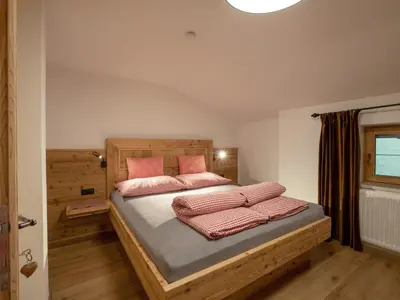 Ein Bett oder Betten in einem Zimmer der Unterkunft Bauernhof Vordermühltal