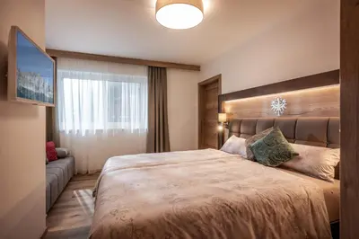 Ein Bett oder Betten in einem Zimmer der Unterkunft APART deluxe am Wilden Kaiser