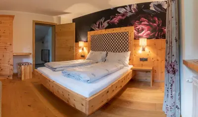 Ein Bett oder Betten in einem Zimmer der Unterkunft SpieljochLodge