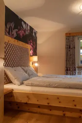 Ein Bett oder Betten in einem Zimmer der Unterkunft SpieljochLodge