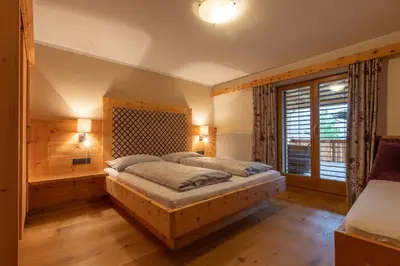 Ein Bett oder Betten in einem Zimmer der Unterkunft SpieljochLodge