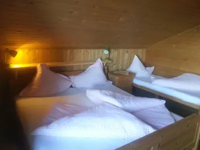 Ein Bett oder Betten in einem Zimmer der Unterkunft Ferienhütte Rist