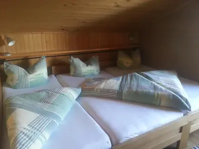 Ein Bett oder Betten in einem Zimmer der Unterkunft Ferienhütte Rist