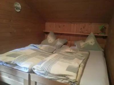 Ein Bett oder Betten in einem Zimmer der Unterkunft Ferienhütte Rist