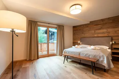Ein Bett oder Betten in einem Zimmer der Unterkunft Wagstätt Residenzen Jochberg by Alpina-Holiday