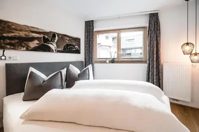 Ein Bett oder Betten in einem Zimmer der Unterkunft Cabin8 Alpine Flair Apartments
