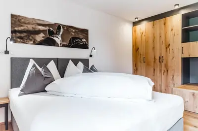 Ein Bett oder Betten in einem Zimmer der Unterkunft Cabin8 Alpine Flair Apartments