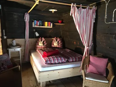 Ein Bett oder Betten in einem Zimmer der Unterkunft Tradlhof