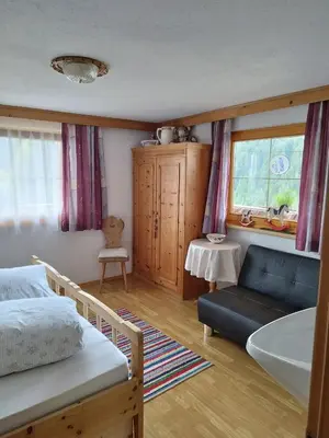 Ein Bett oder Betten in einem Zimmer der Unterkunft Ferienwohnung Spitaler Unterkofler