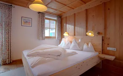 Ein Bett oder Betten in einem Zimmer der Unterkunft Appartements Kirchenwirt